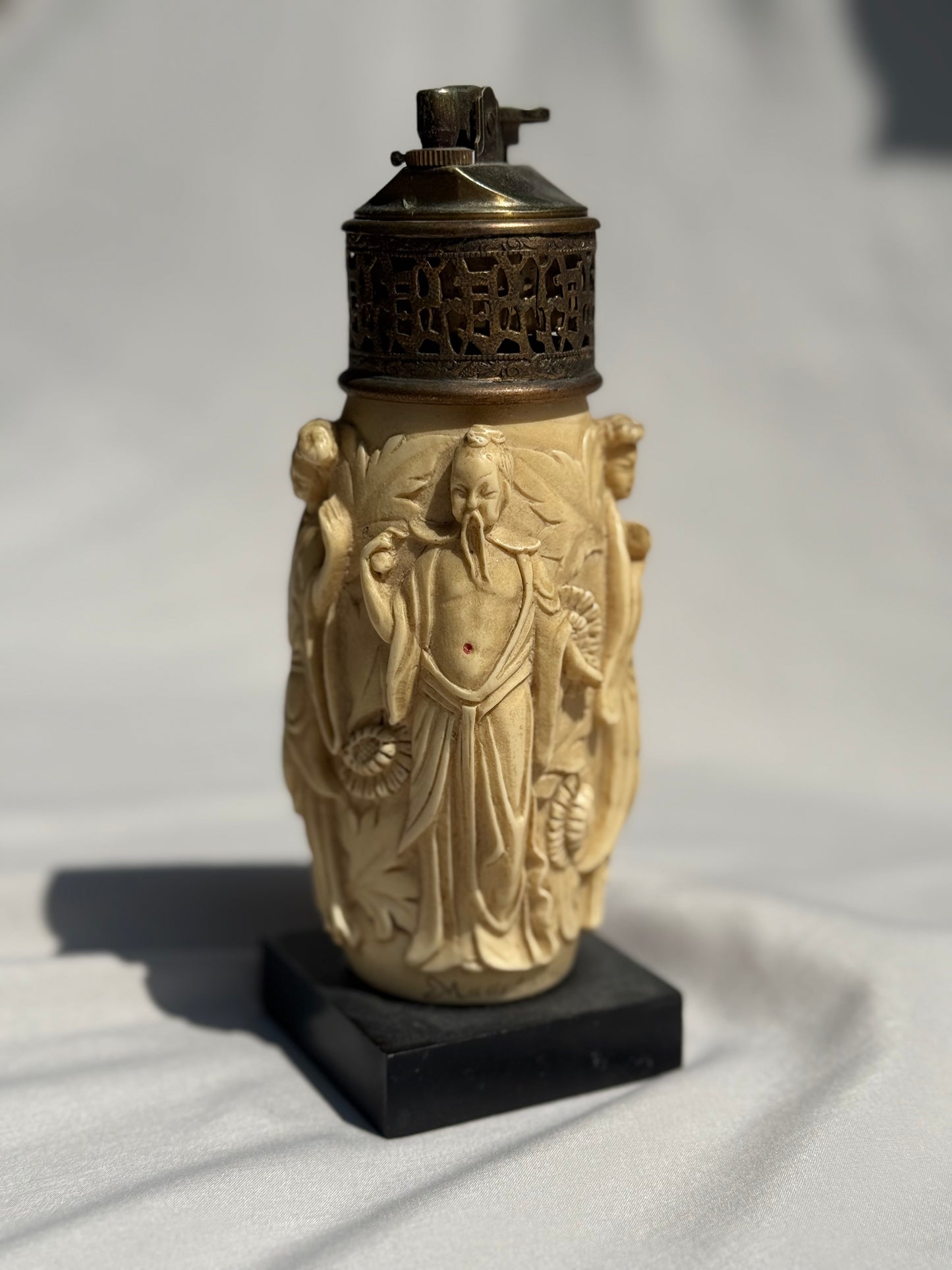 Vintage Asian-Inspired Tabletop Lighter Carved Figural Design on Faux Ivory Resin Ornate Brass Top