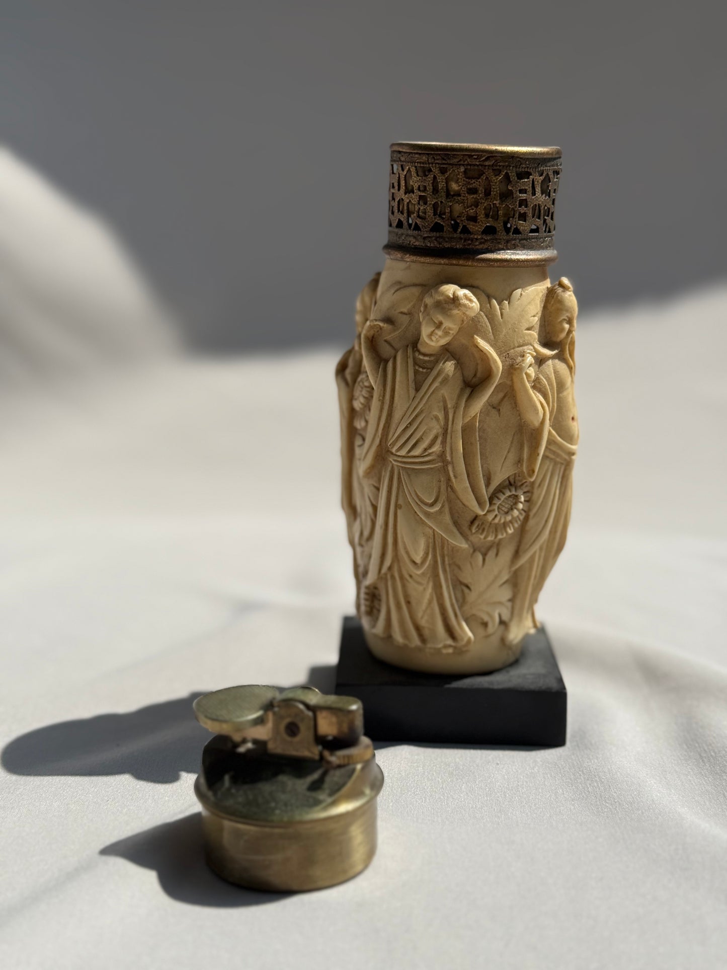 Vintage Asian-Inspired Tabletop Lighter Carved Figural Design on Faux Ivory Resin Ornate Brass Top